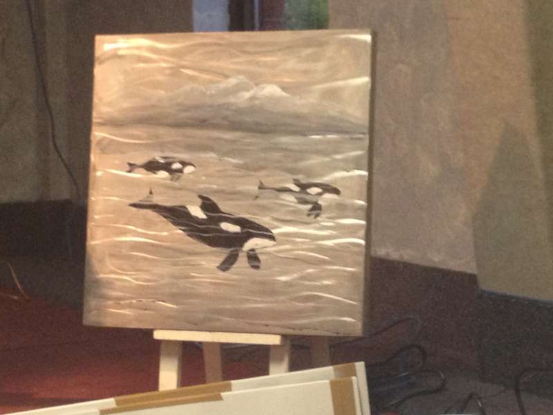 The Orcas painting with wave lines painted over whales